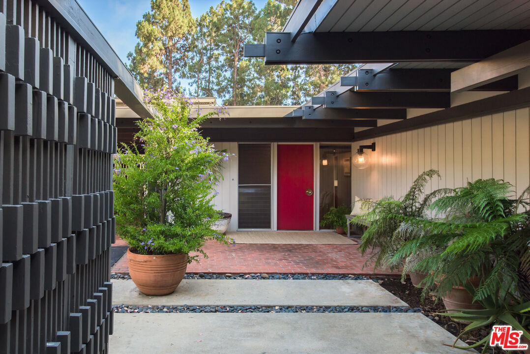 1030 Rivas Canyon Road Pacific Palisades, CA 90272 - Photo 38 of 42 a view of a house with potted plants
