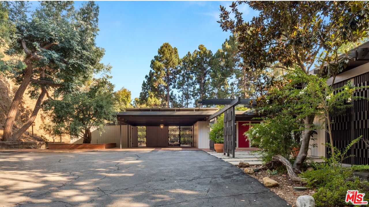 1030 Rivas Canyon Road Pacific Palisades, CA 90272 - Photo 40 of 42 a front view of a house with garden