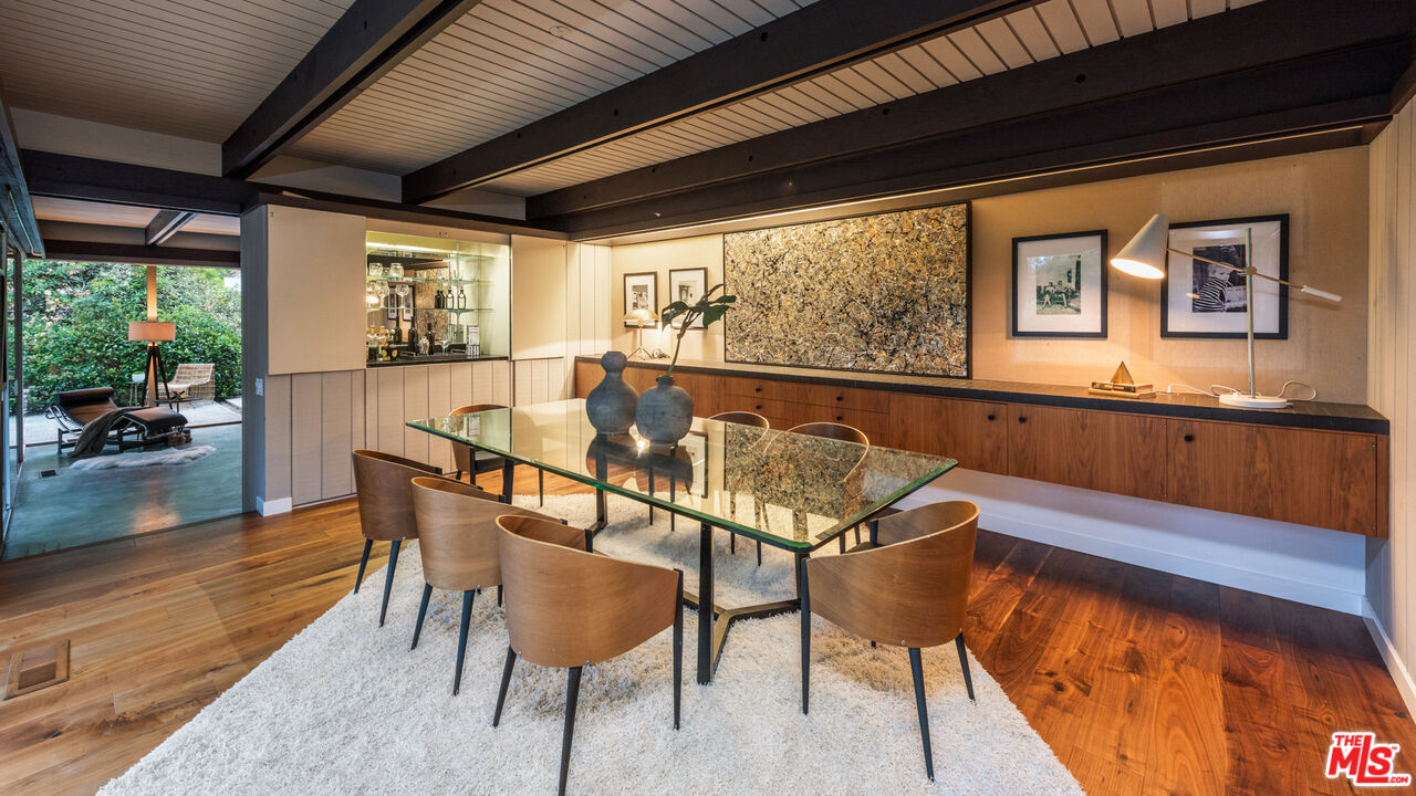 1030 Rivas Canyon Road Pacific Palisades, CA 90272 - Photo 7 of 42 a view of a dining room with furniture window and wooden floor