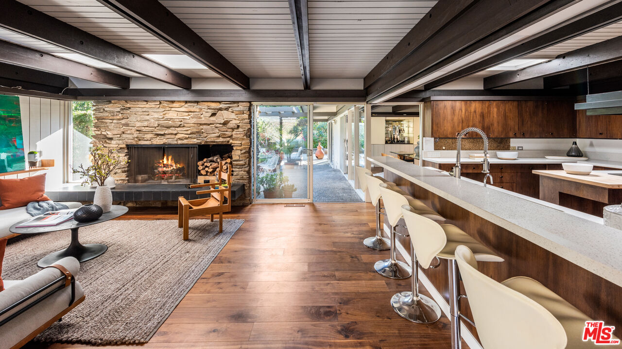 1030 Rivas Canyon Road Pacific Palisades, CA 90272 - Photo 10 of 42 a very nice looking living room with dining room and wooden floors