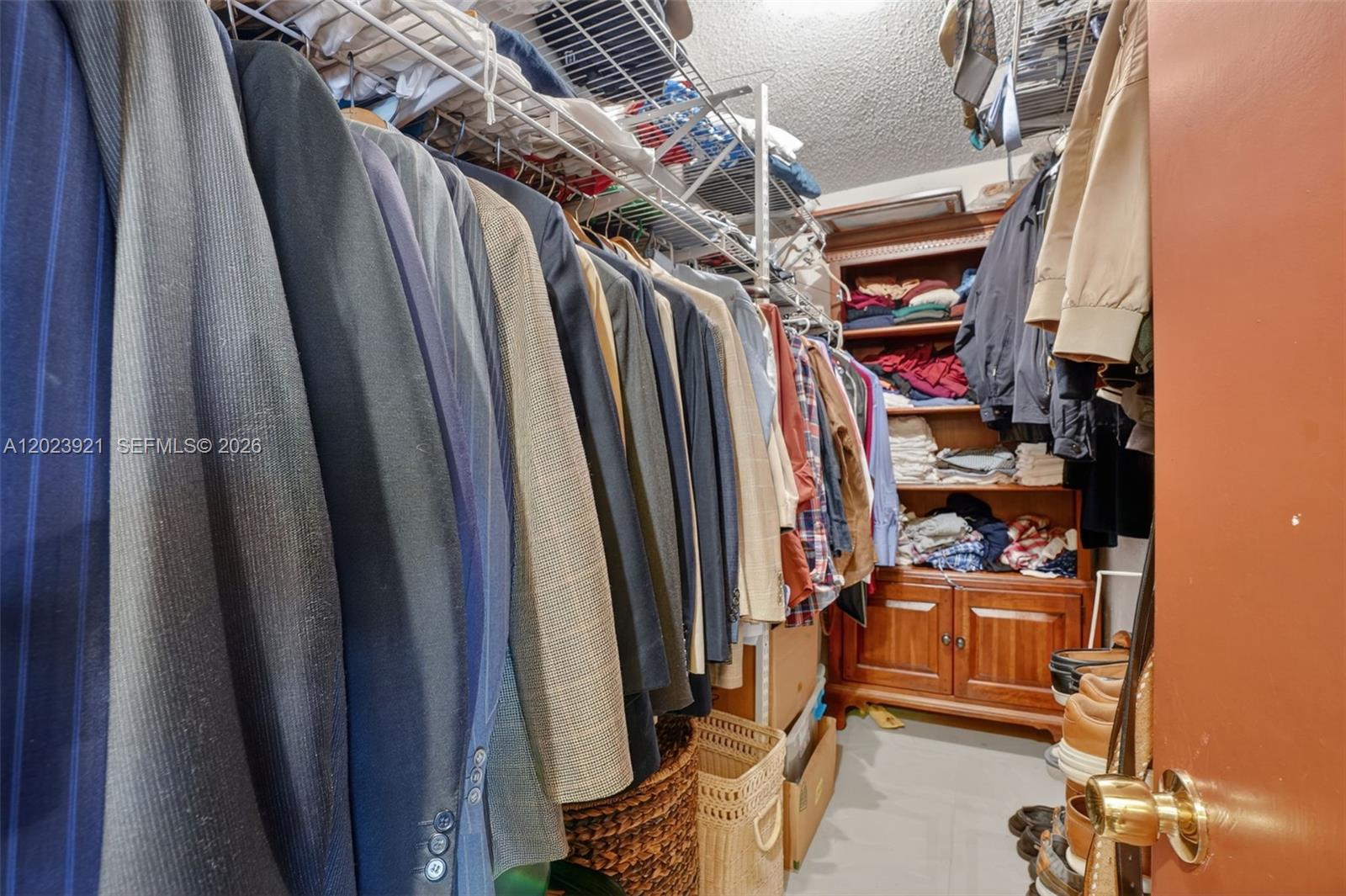 8461 Southwest 68th St Road Miami, FL 33143 - Photo 28 of 65 a view of walk in closet with clothes and shoes
