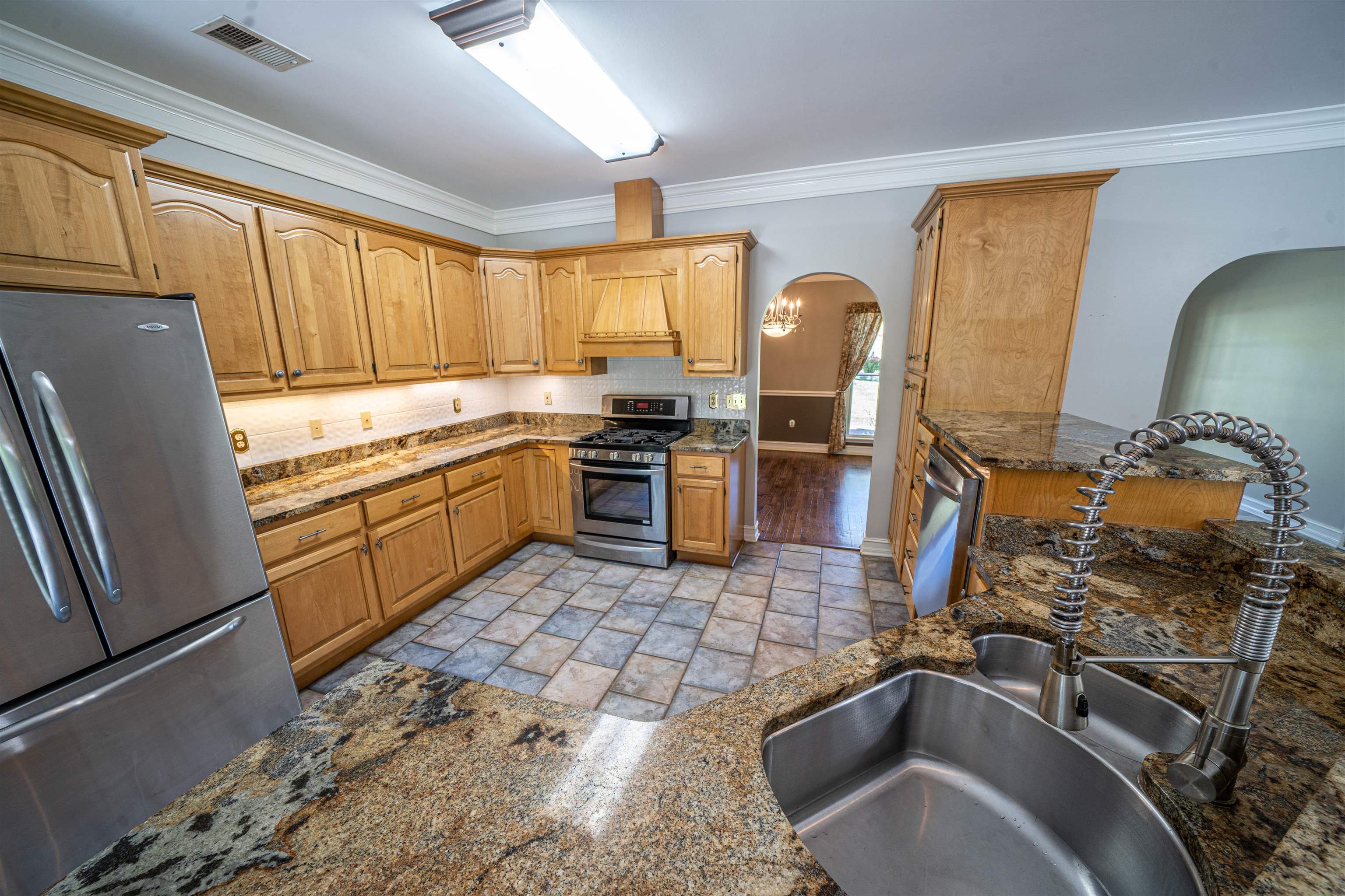 345 Allen Road Williston, TN 38076 - Photo 13 of 25 a kitchen with stainless steel appliances granite countertop a sink stove and refrigerator