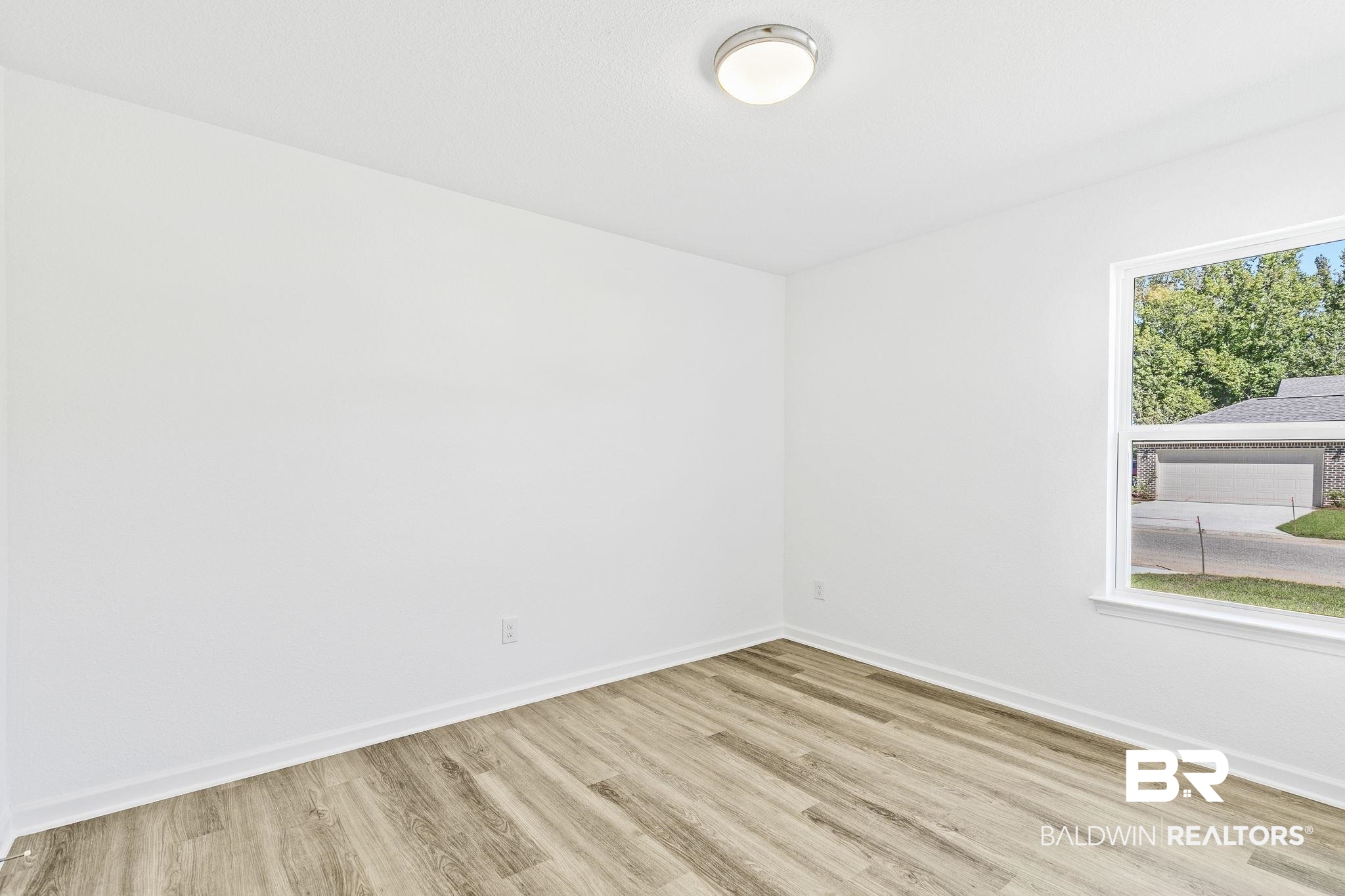 16014 Alabama Avenue Silverhill, AL 36576 - Photo 31 of 50 Unfurnished room with light hardwood / wood-style flooring