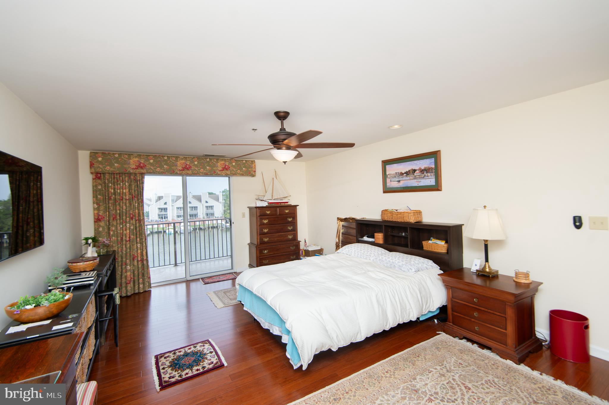 304 Academy Street, Unit 202 Cambridge, MD 21613 - Photo 14 of 40 Custom drapes and high-end vertical shades.