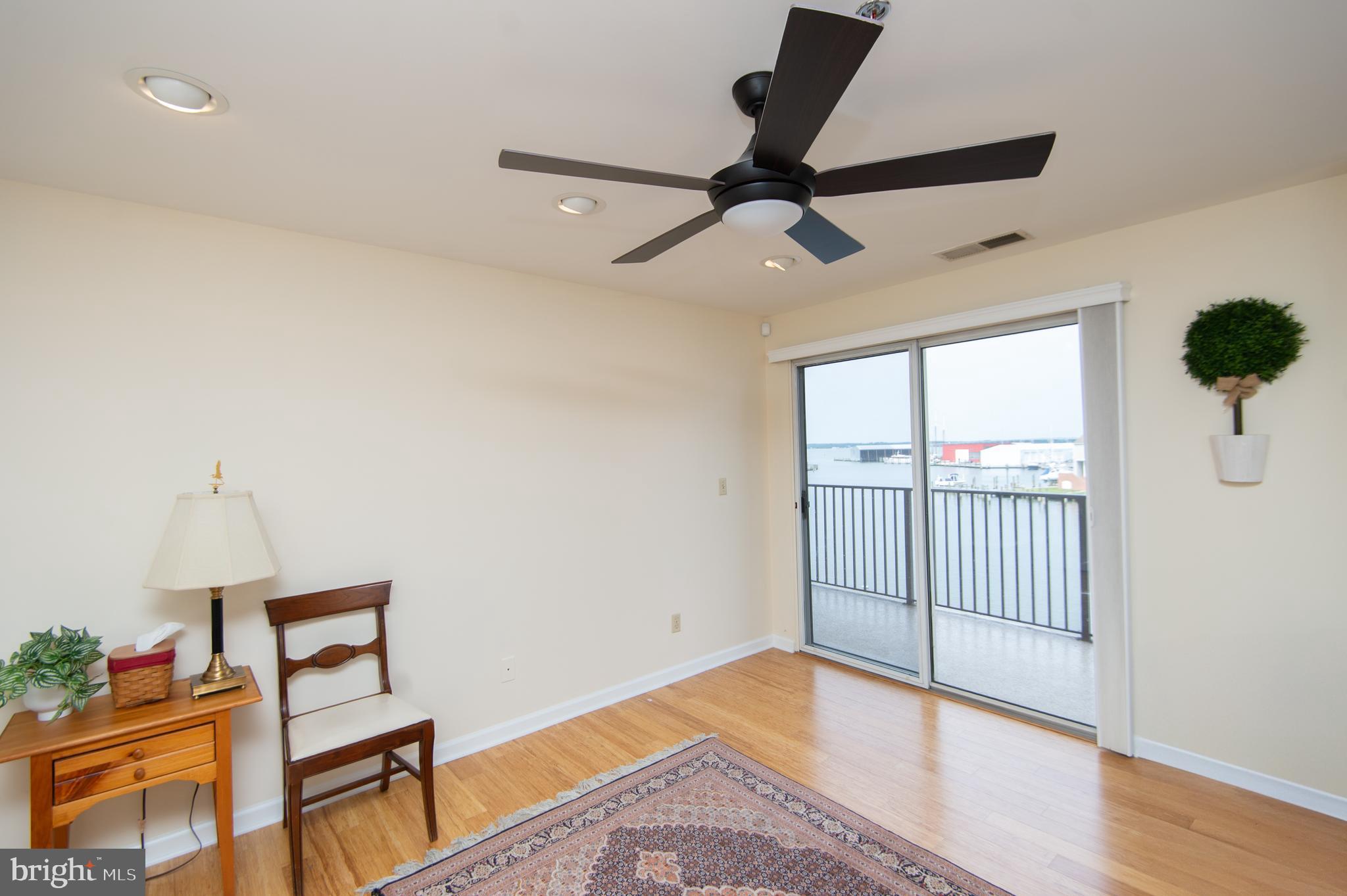 304 Academy Street, Unit 202 Cambridge, MD 21613 - Photo 21 of 40 BR 2 with balcony access and vertical shades