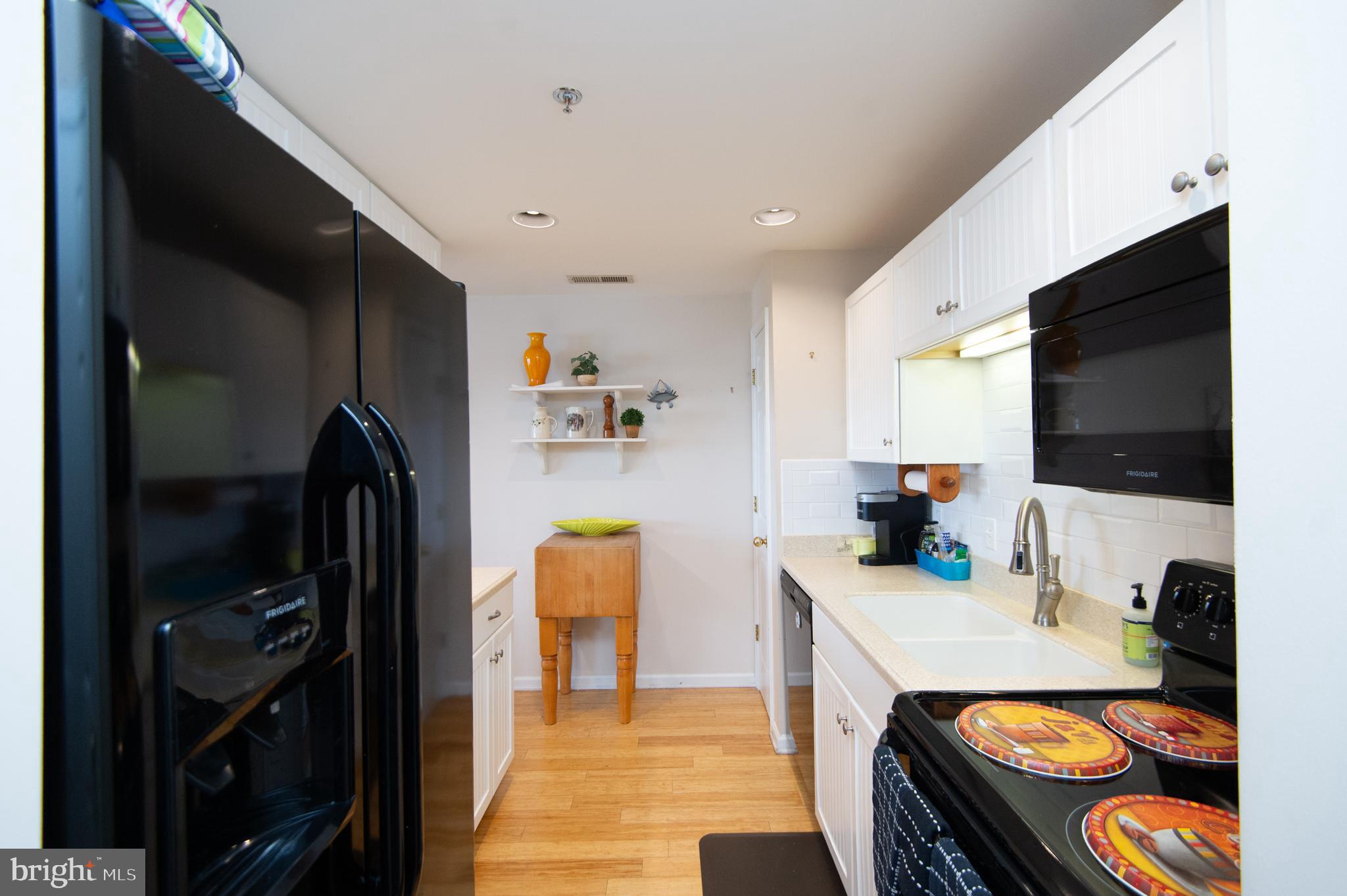 304 Academy Street, Unit 202 Cambridge, MD 21613 - Photo 25 of 40 Galley kitchen
