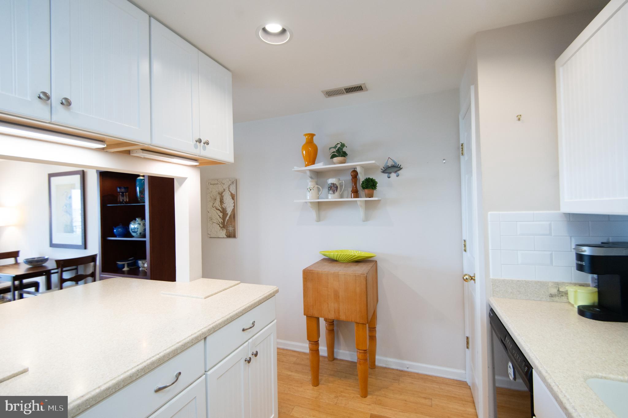 304 Academy Street, Unit 202 Cambridge, MD 21613 - Photo 27 of 40 Peninsula counter open to LR.