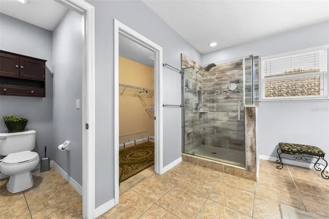 a bath room with a sink and a mirror