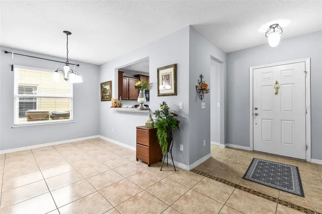 a view of an entryway with wooden floor and a window