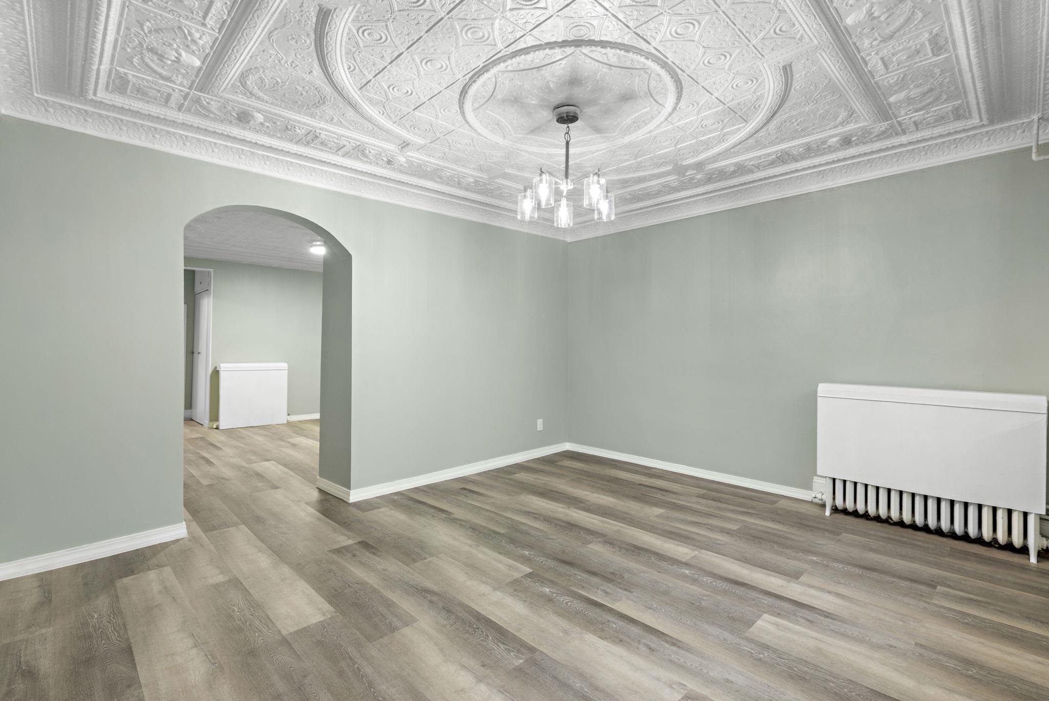 197 Hutton Street, Unit 1 Jersey City, NJ 07307 - Photo 1 of 15 a view of a chandelier fan and wooden floor