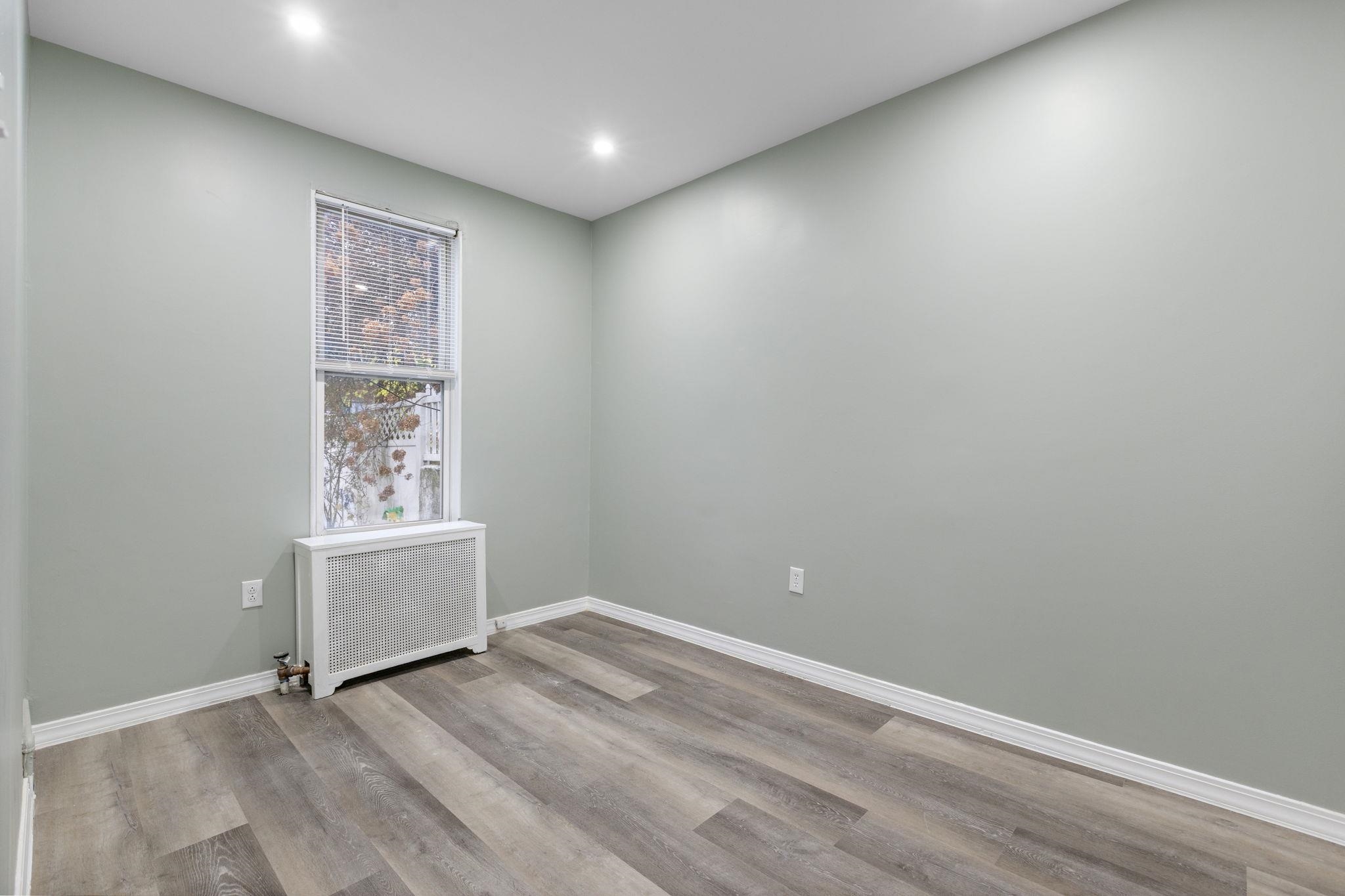 197 Hutton Street, Unit 1 Jersey City, NJ 07307 - Photo 11 of 15 a view of room and window