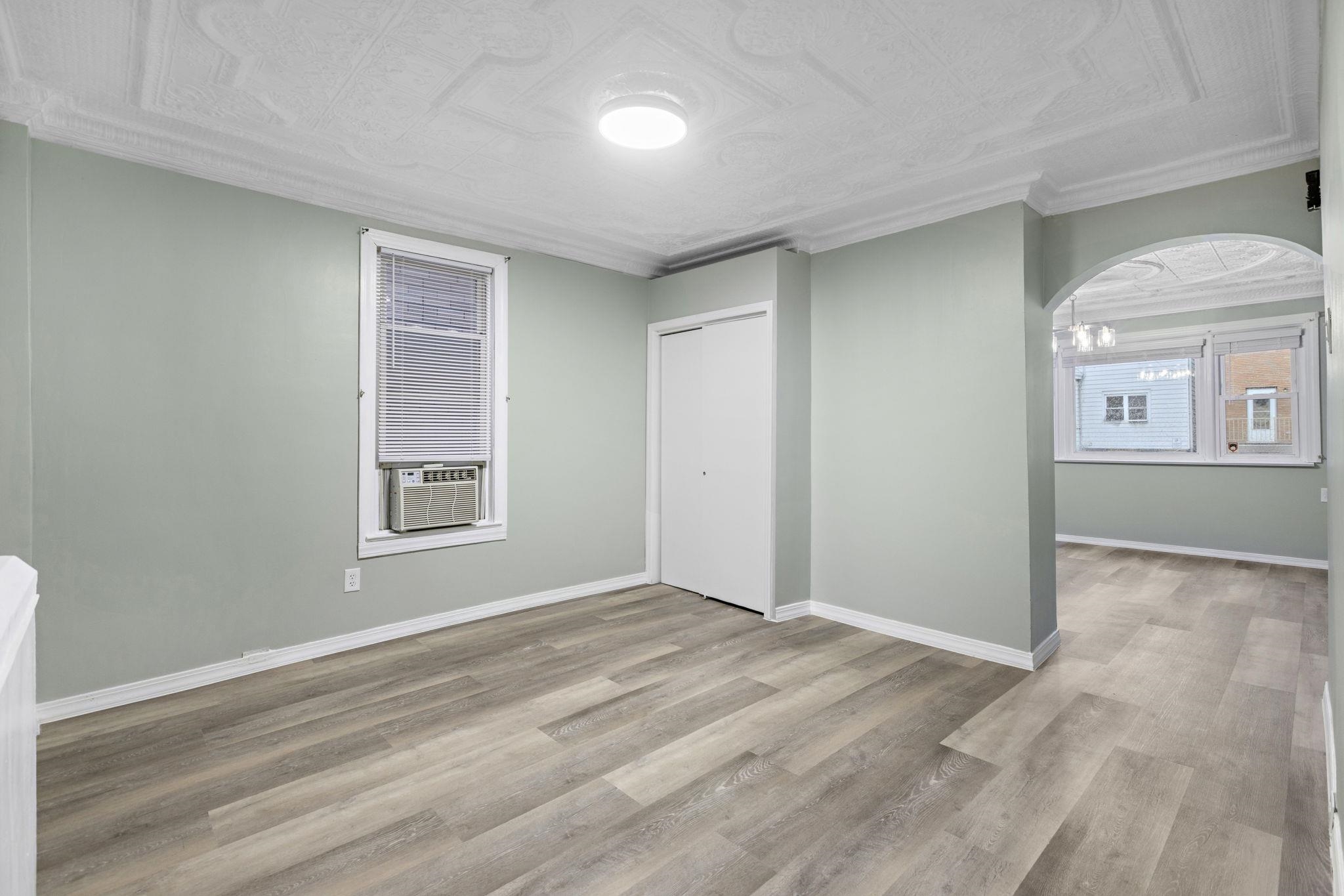 197 Hutton Street, Unit 1 Jersey City, NJ 07307 - Photo 5 of 15 a view of livingroom with window