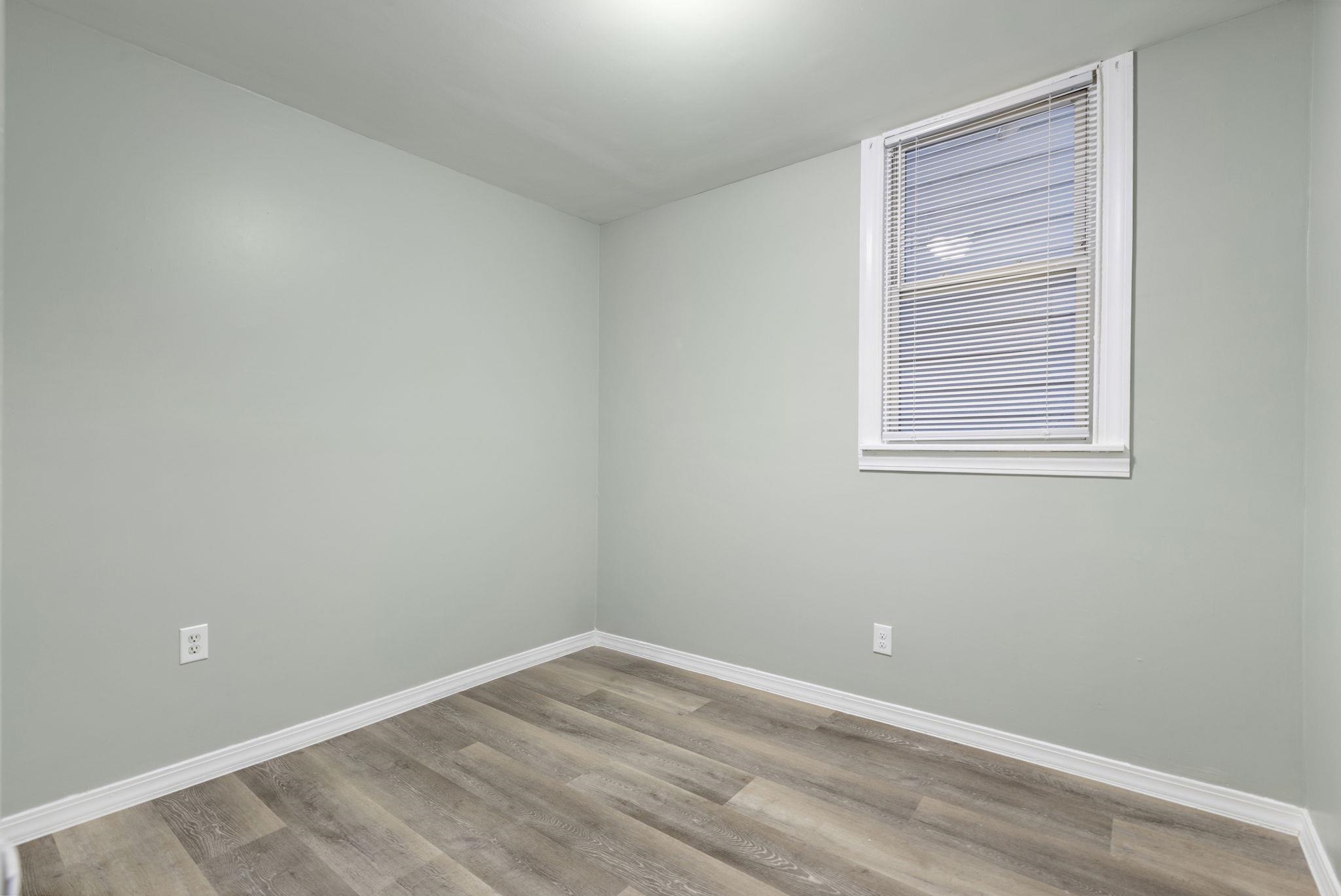 197 Hutton Street, Unit 1 Jersey City, NJ 07307 - Photo 10 of 15 an empty room with a window