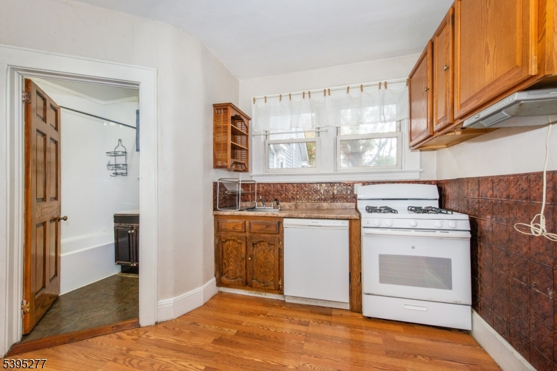 16 Willet Street Bloomfield, NJ 07003 - Photo 16 of 19 a kitchen with stainless steel appliances granite countertop a stove a sink and a refrigerator