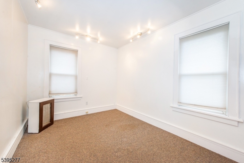 16 Willet Street Bloomfield, NJ 07003 - Photo 17 of 19 an empty room with windows and closet