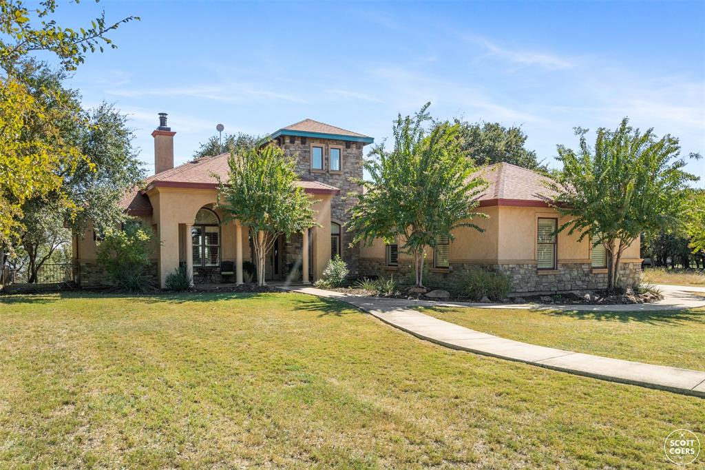 600 Oak Point Drive May, TX 76857 - Photo 1 of 1 a front view of house with yard and trees