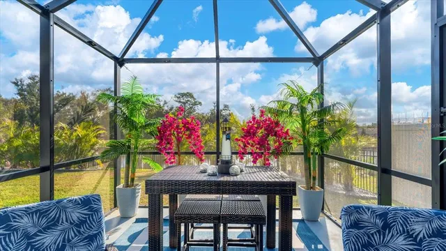 a view of a dining room with furniture window and outside view