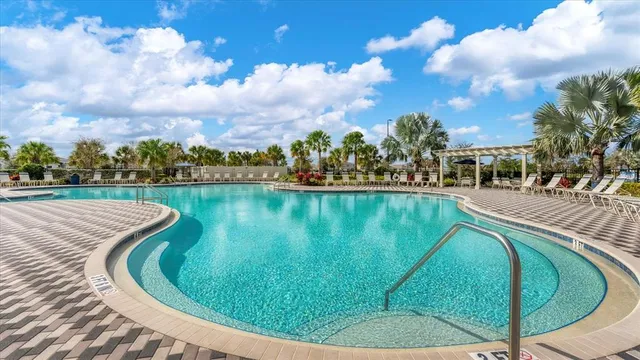 a view of a swimming pool with a yard
