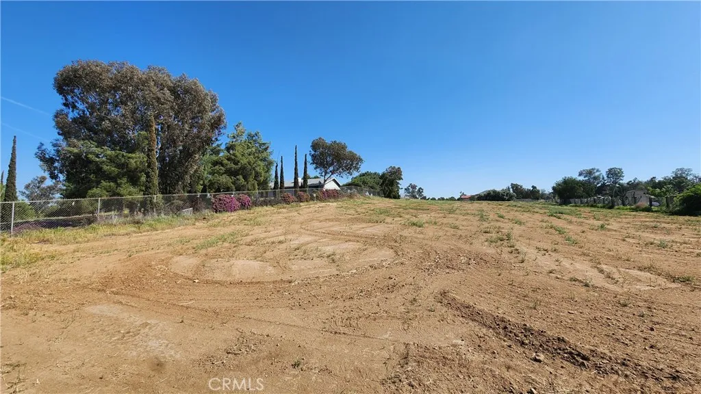 0 West Rider Street Perris, CA 92570 - Photo 4 of 19 a view of a yard with trees in the background