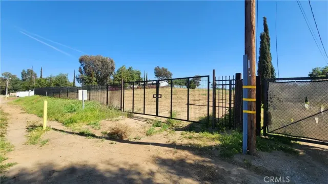 a view of a garden with a building in the background