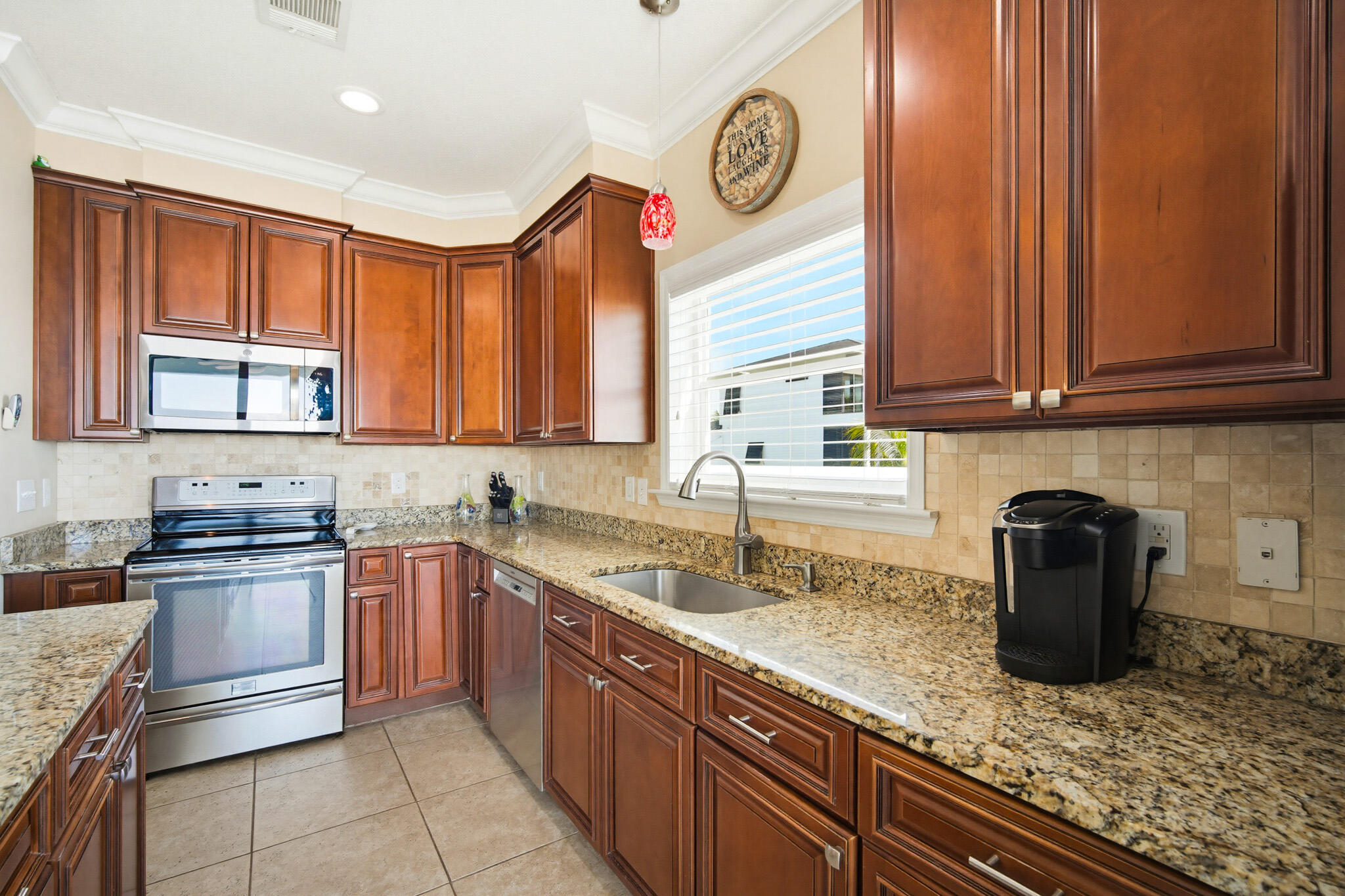 183 Star Lane Key West, FL 33040 - Photo 21 of 70 a kitchen with stainless steel appliances granite countertop a sink dishwasher stove and cabinets