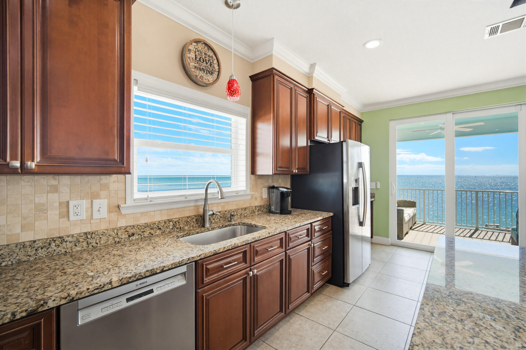 183 Star Lane Key West, FL 33040 - Photo 23 of 70 a kitchen with stainless steel appliances granite countertop a sink stove and refrigerator