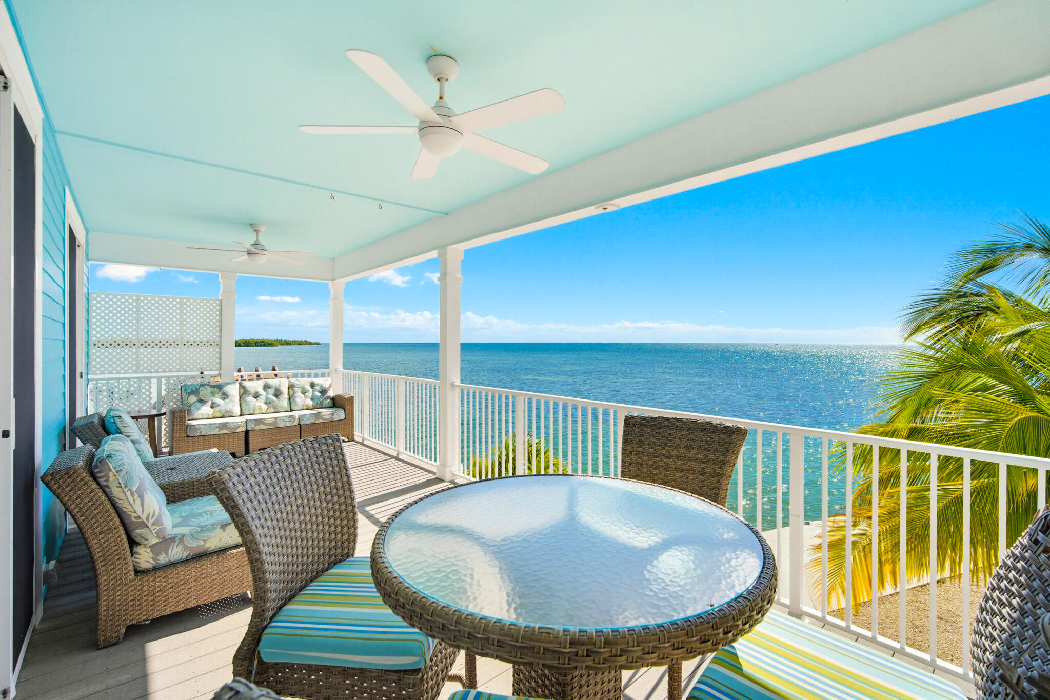 183 Star Lane Key West, FL 33040 - Photo 26 of 70 a balcony with table and chairs