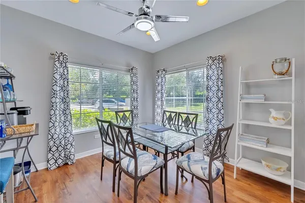 a view of a dining room with furniture window and wooden floor