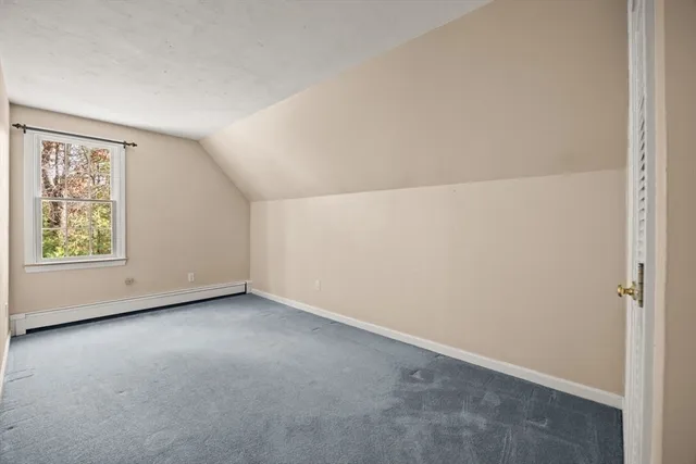 a bathroom with a sink a toilet and a window