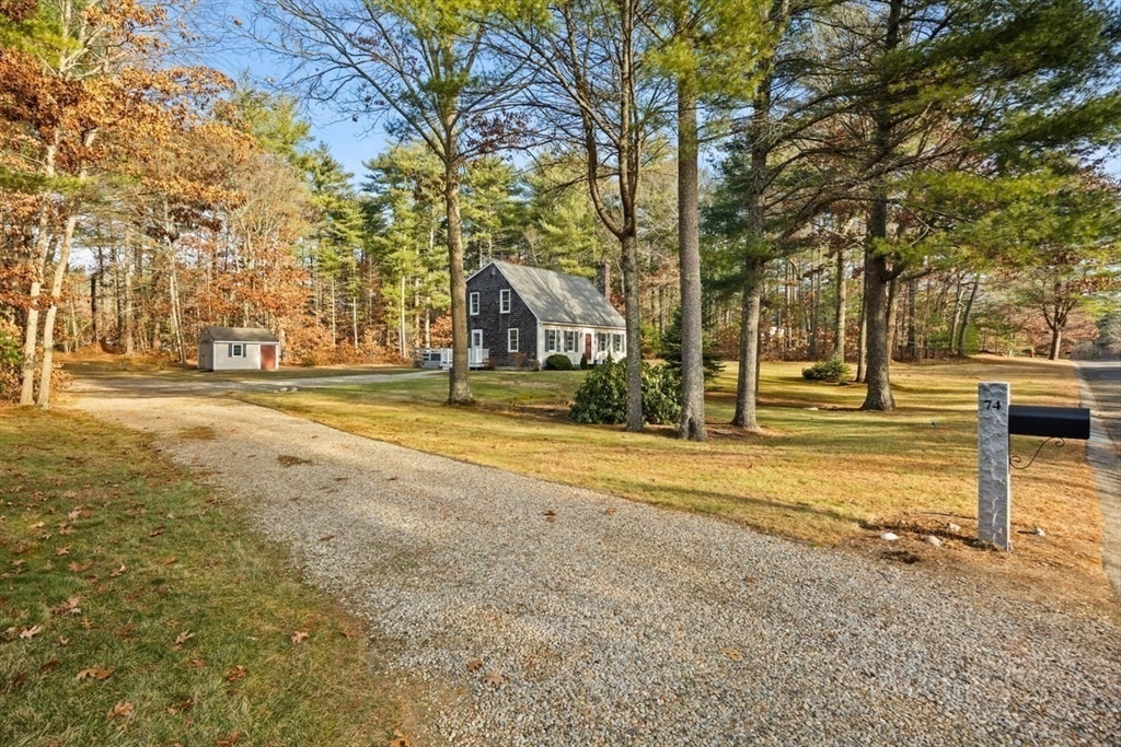 74 Higgins Road Kingston, MA 02364 - Photo 3 of 35 a view of a city with large trees