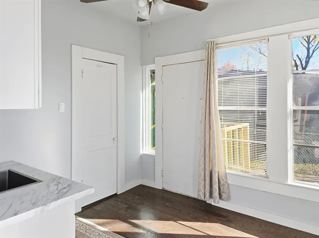 a kitchen with stainless steel appliances a stove a microwave and cabinets