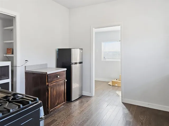 a view of wooden house with a roof deck