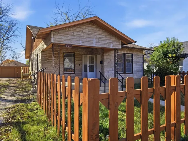 a front view of house with parking space