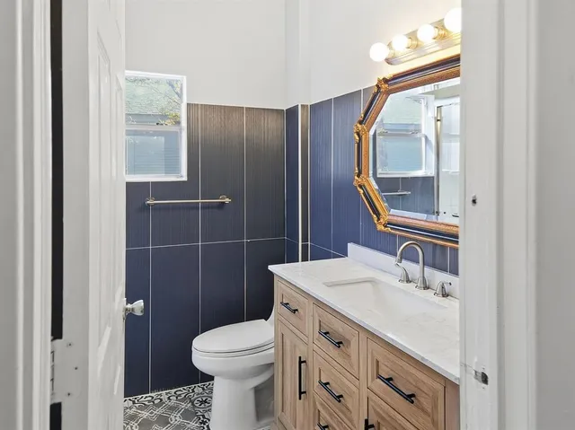 a bathroom with a shower and a window
