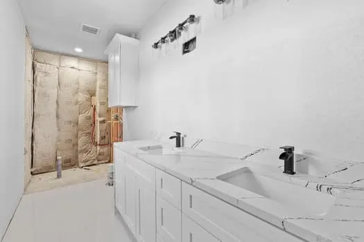 a bathroom with a sink and a mirror