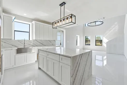 a kitchen with sink cabinets and window