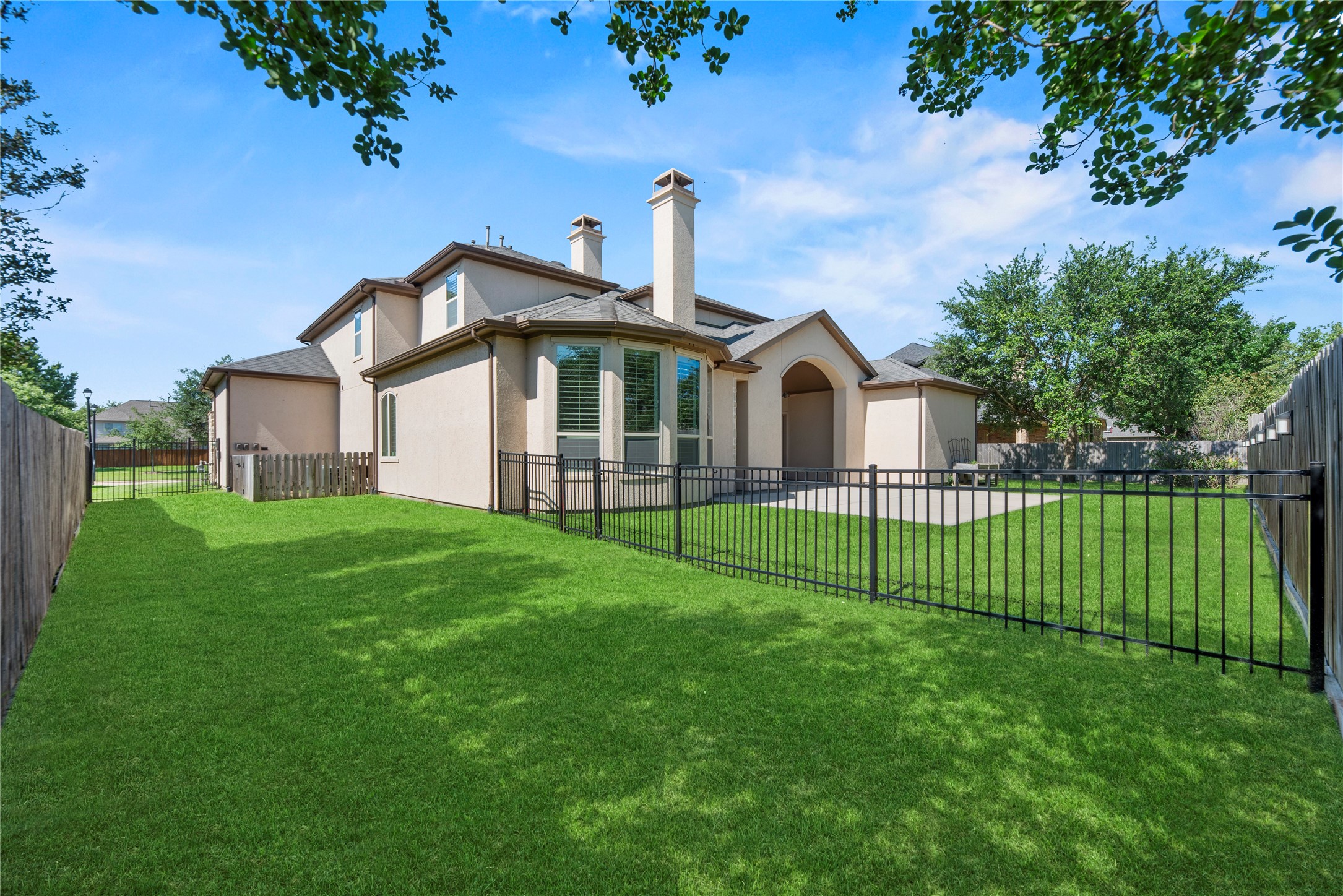 28226 South Firethorne Road Katy, TX 77494 - Photo 29 of 39 A perspective of the beautifully maintained grounds, showcasing the home's premier position and the privacy offered by the fully fenced backyard.