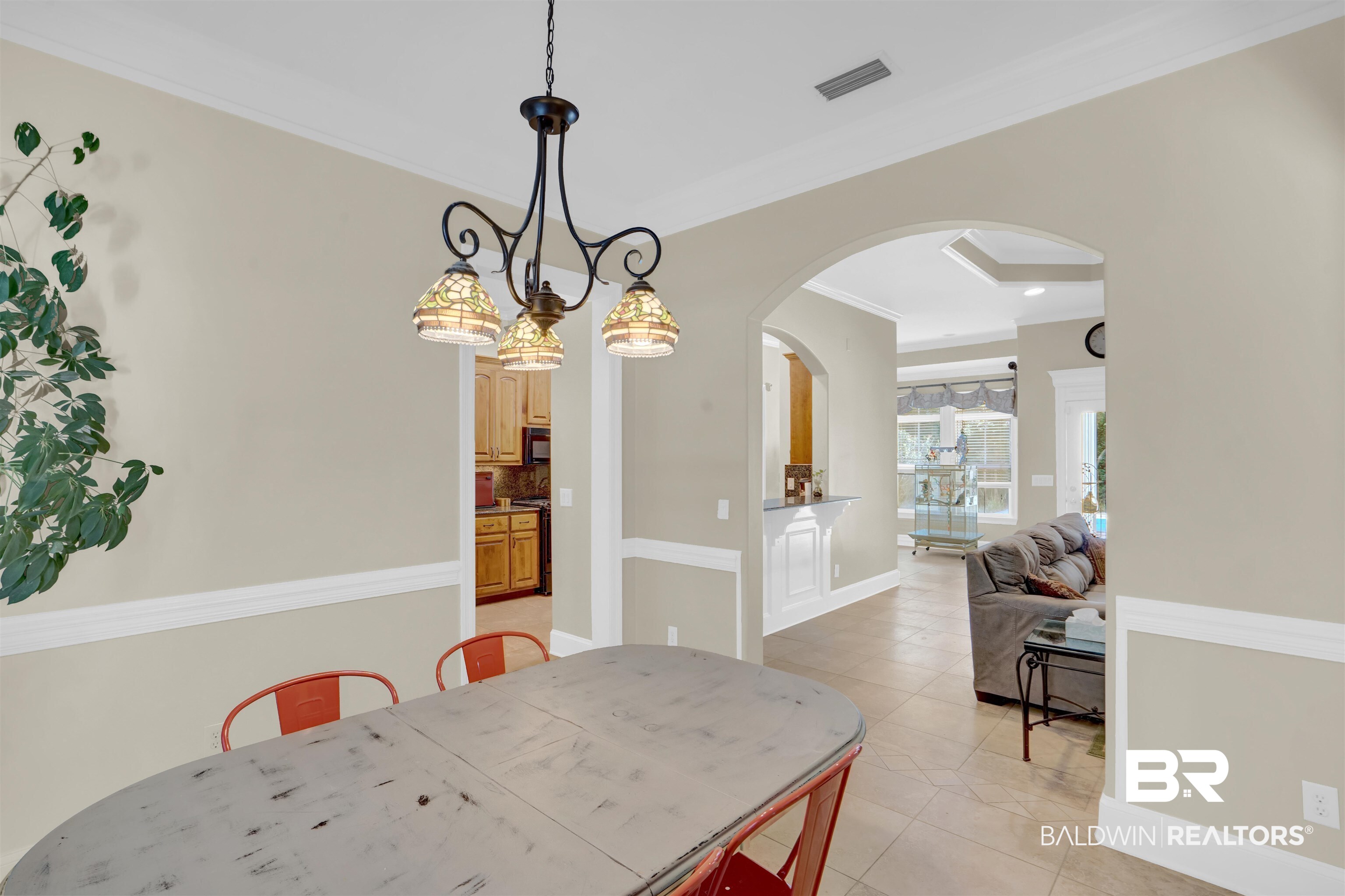 10951 Driver Court Fairhope, AL 36532 - Photo 14 of 46 Dining space with ornamental molding and light tile patterned floors