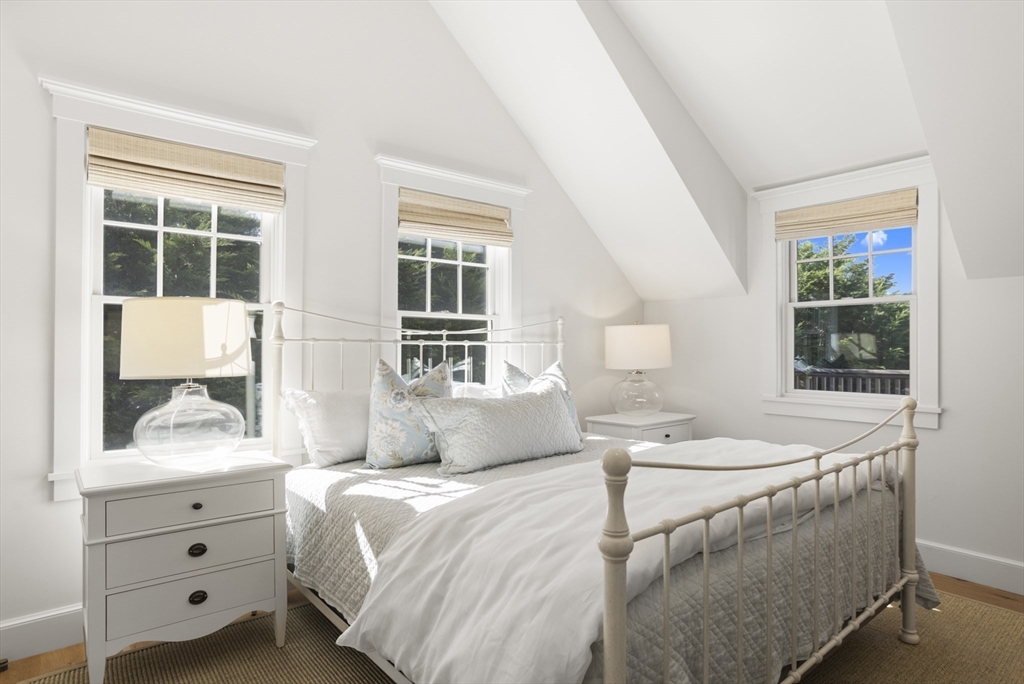 13 A Gingy Lane Nantucket, MA 02554 - Photo 12 of 29 a bedroom with a bed and wooden floor