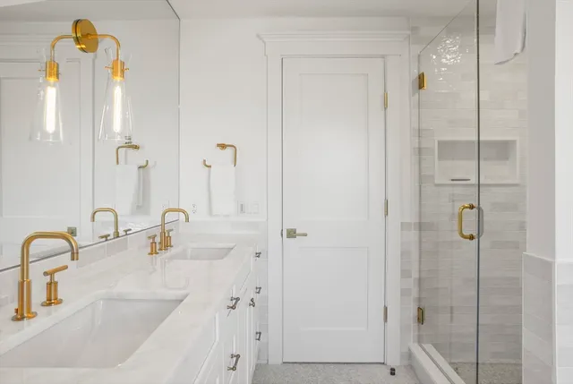 a bathroom with a sink and a shower