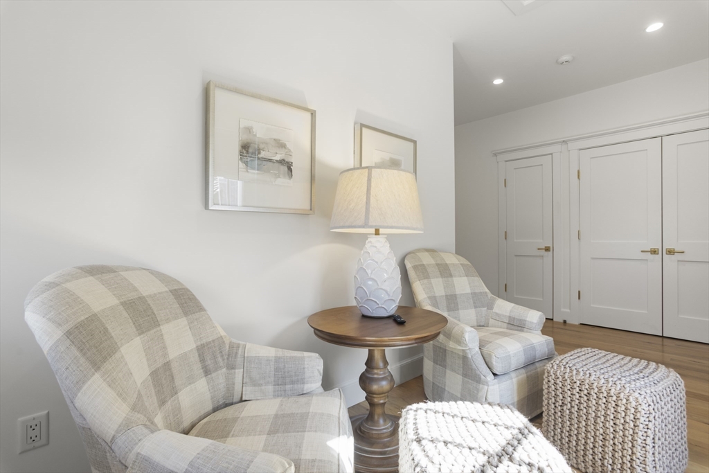 13 A Gingy Lane Nantucket, MA 02554 - Photo 14 of 29 a living room with furniture and a table