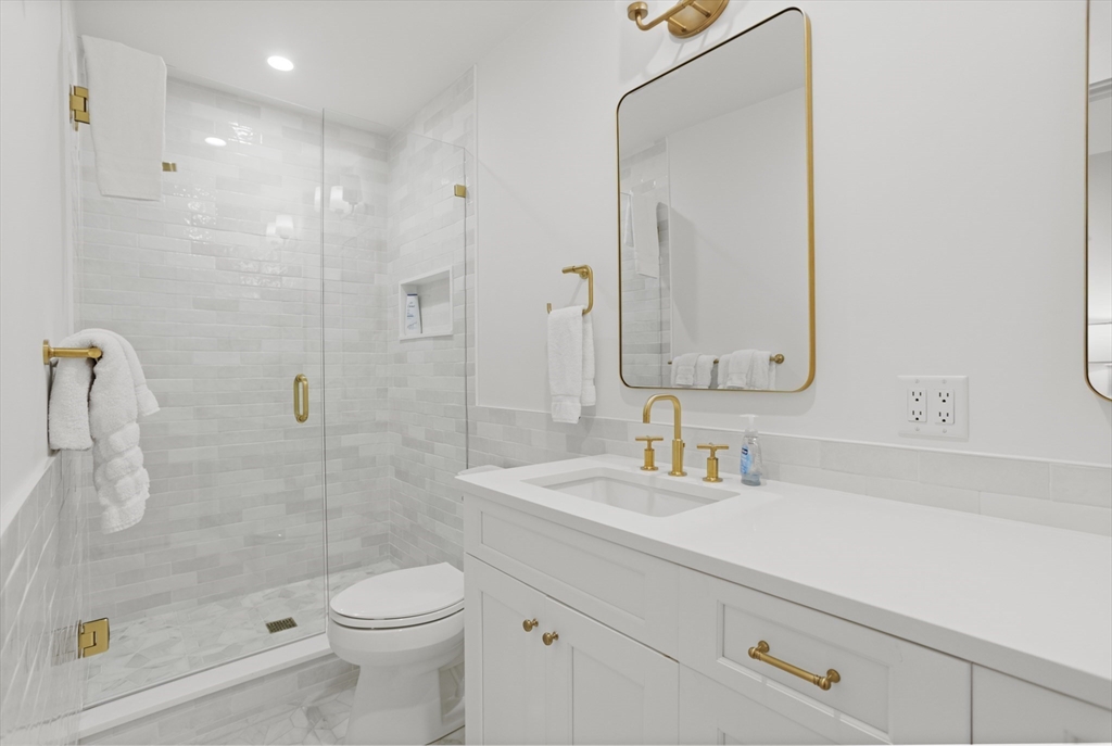 13 A Gingy Lane Nantucket, MA 02554 - Photo 20 of 29 a bathroom with a sink a toilet and shower