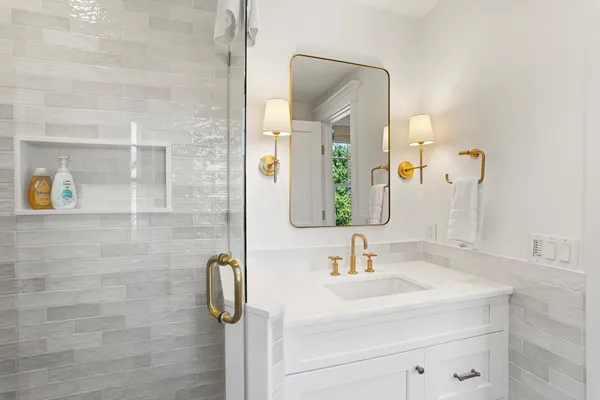 a bathroom with a sink and mirror