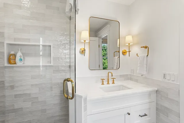a bathroom with a sink and mirror