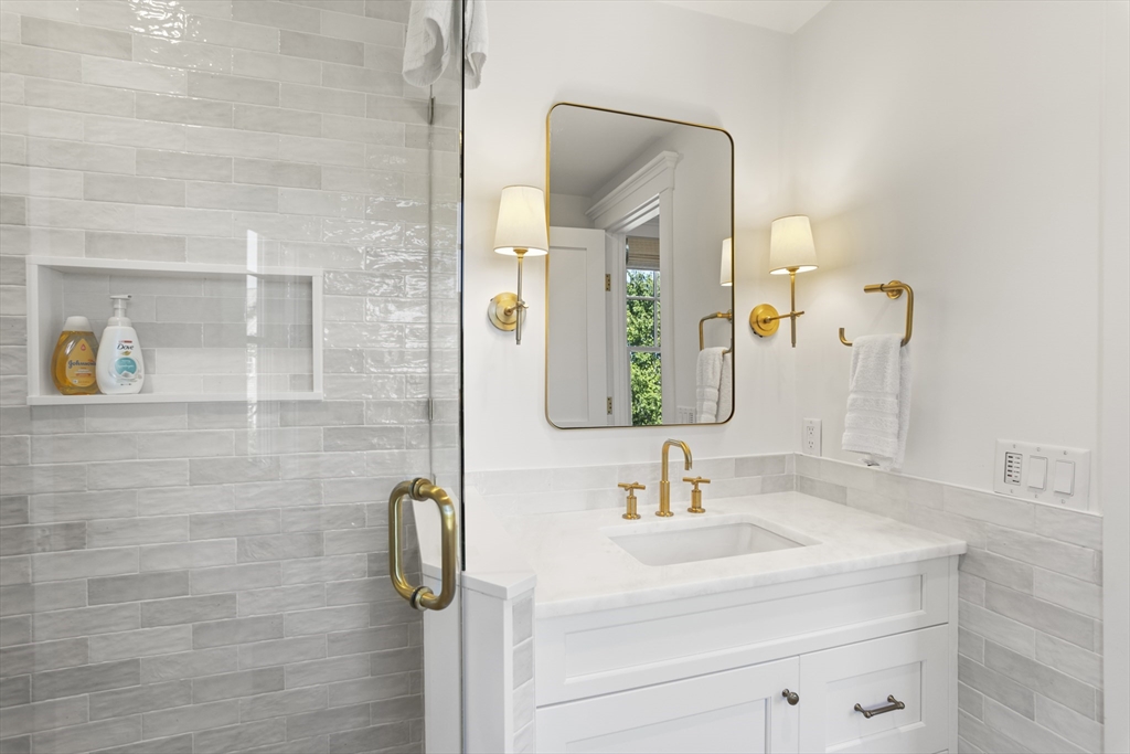 13 A Gingy Lane Nantucket, MA 02554 - Photo 24 of 29 a bathroom with a sink and mirror