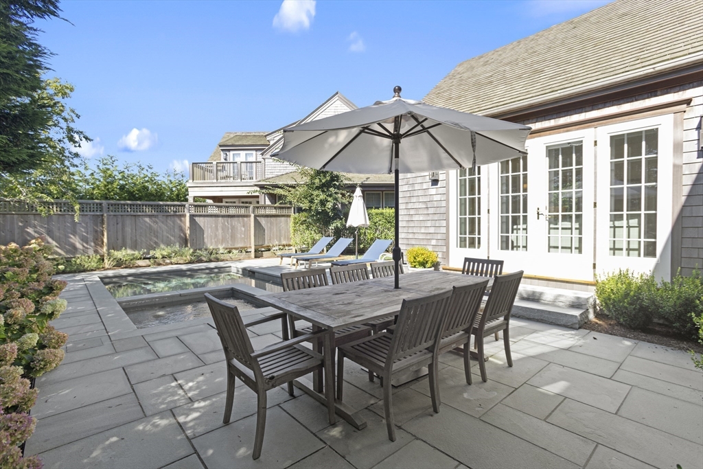 13 A Gingy Lane Nantucket, MA 02554 - Photo 29 of 29 a view of a house with backyard and sitting area