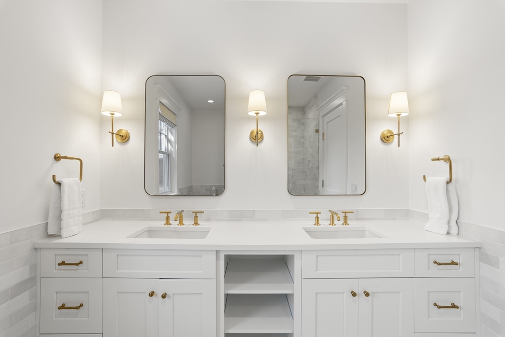 13 A Gingy Lane Nantucket, MA 02554 - Photo 10 of 29 a bathroom with double vanity sinks and a mirror