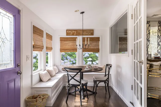 a dining room with furniture and windows