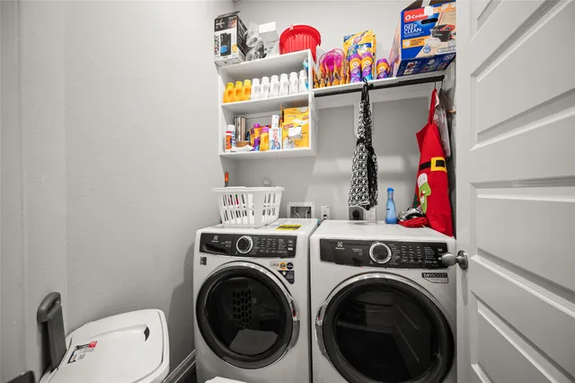 a utility room with dryer and washer