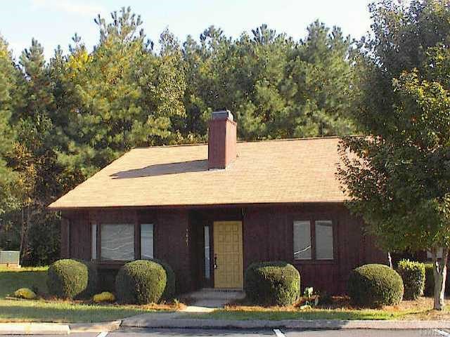 7623 Ladden Court Raleigh, NC 27615 - Photo 1 of 1 a front view of a house with garden